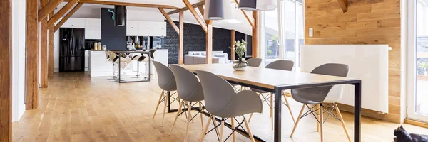 Wooden apartment with family table — Stock Photo, Image