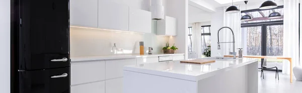 Modern kitchen with black fridge — Stock Photo, Image