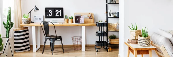 Black designer chair in workspace — Stock Photo, Image