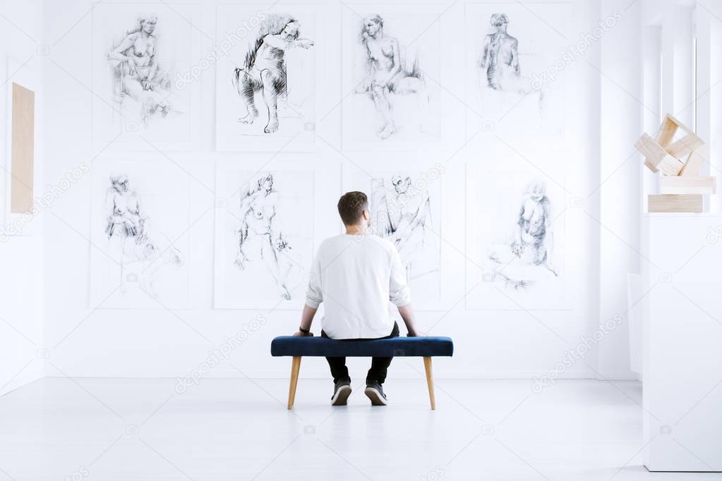 Man relaxing in art gallery