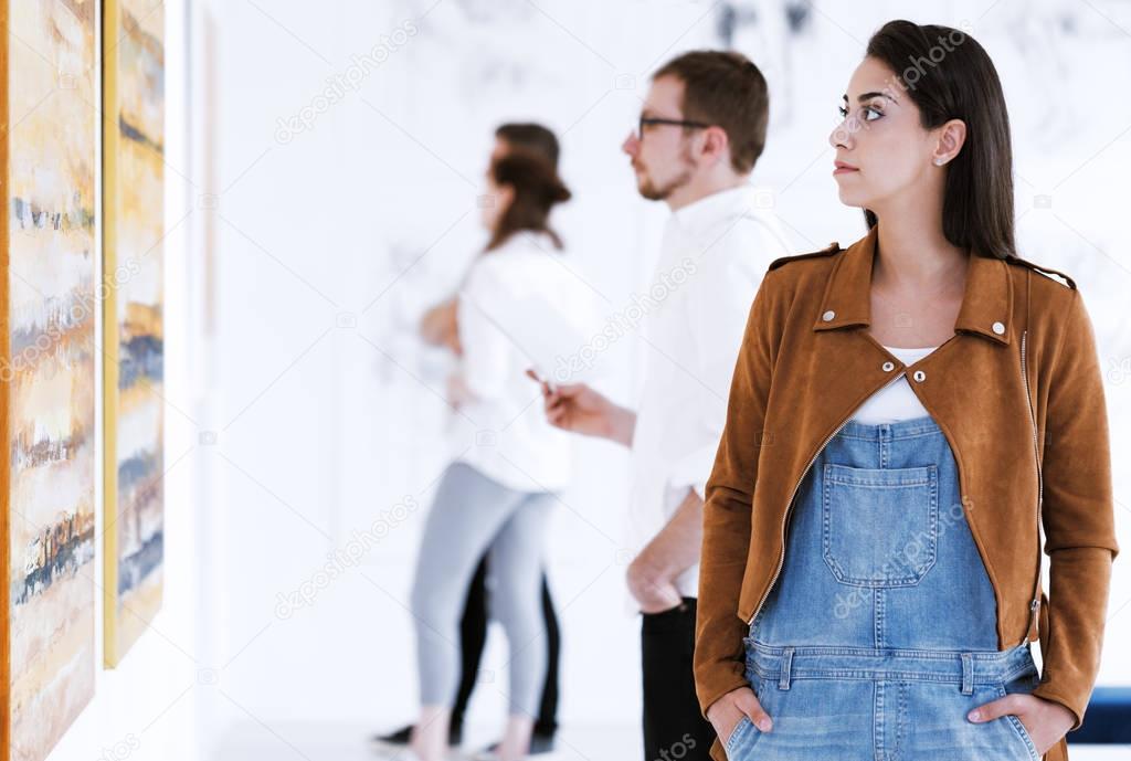 Casual dressed woman in gallery