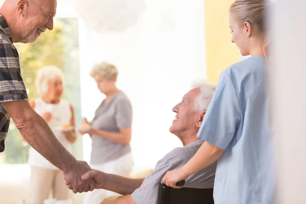 Elder men shaking hands — Stock Photo, Image