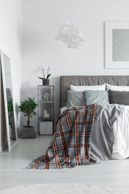 Cozy interior of monochromatic bedroom clipart