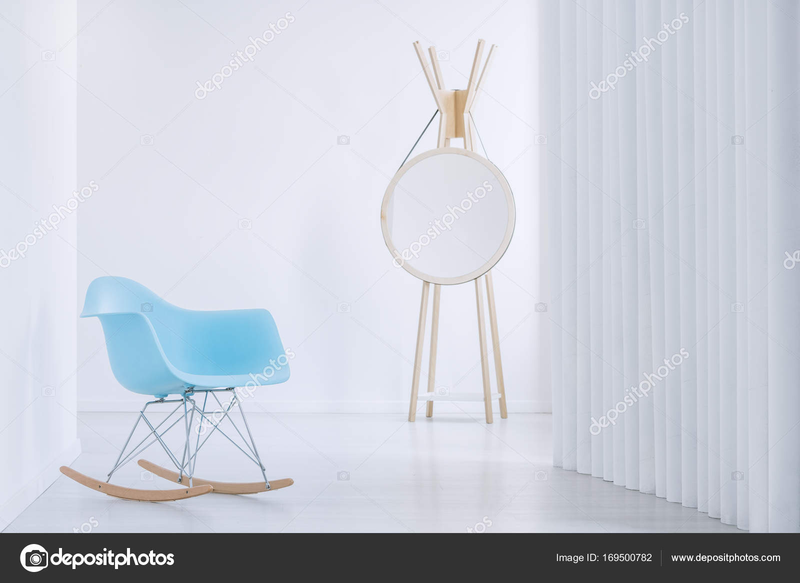 Modern Mirror Next To Wall Stock Photo Photographee Eu 169500782 Close Up Of Blue Rocking Armchair And Modern Round Mirror Next To A Wall Photo By Photographee Eu
