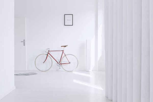 Red bike against wall