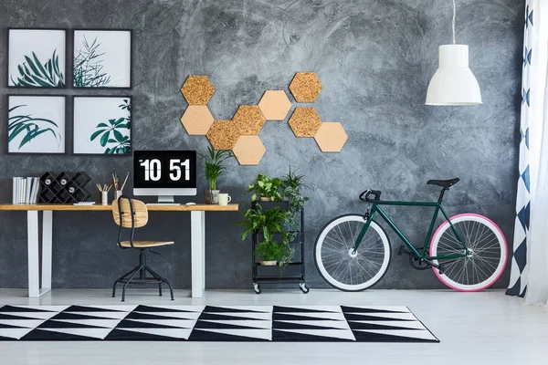 Spacious work area with bicycle