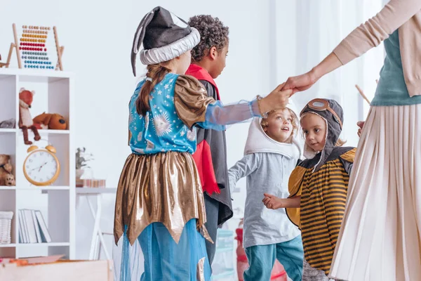 Children dancing in circle