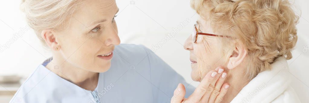 Doctor examining a senior patient