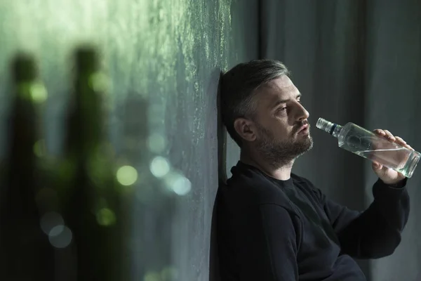 Lonely man drinking vodka — Stock Photo, Image