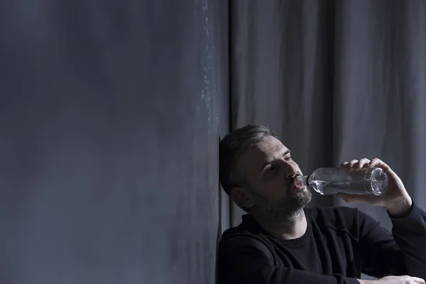 Unhappy man drinking alcohol — Stock Photo, Image