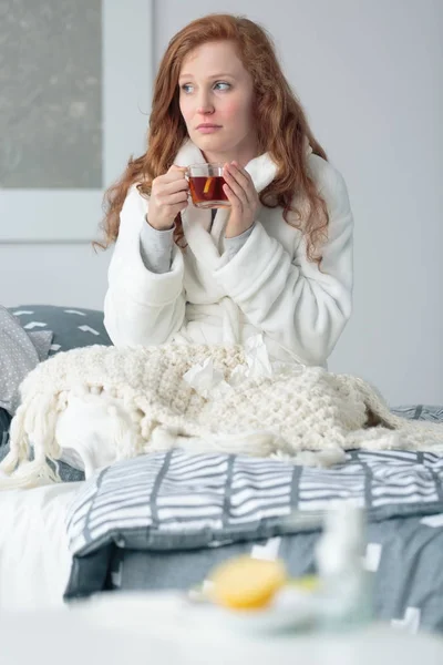 Woman with flu drinking mixture — Stock Photo, Image