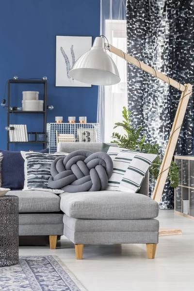 Blue apartment with wooden lamp