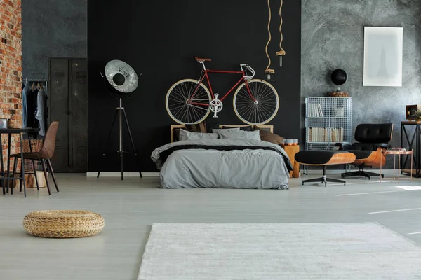 Spacious bedroom with red bike