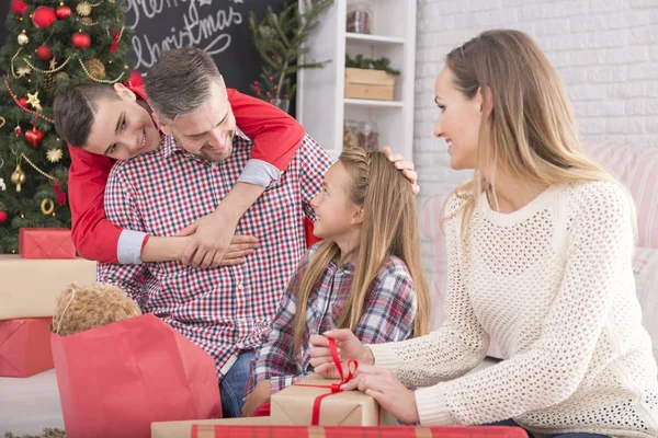 Young boy embracing father — Stock Photo, Image