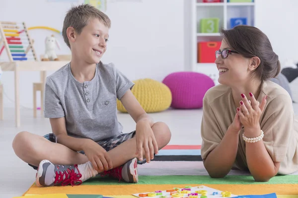 Happy child and school counselor — Stock Photo, Image