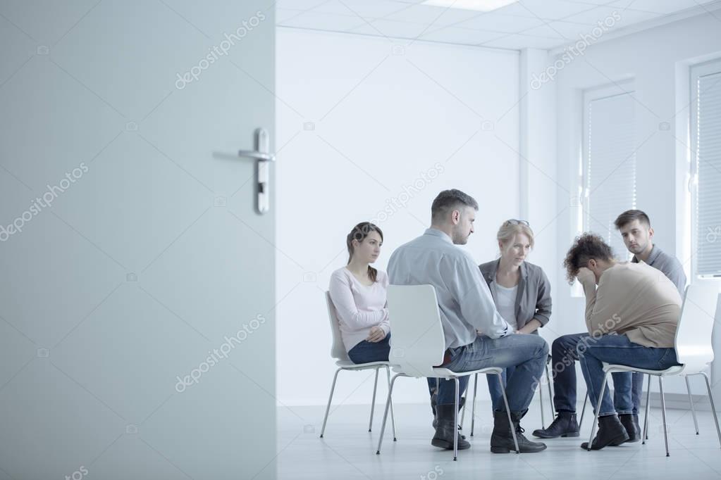 Woman crying in rehab center