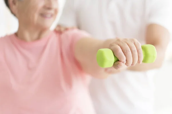 Close-up of person with dumbbell — Stock Photo, Image