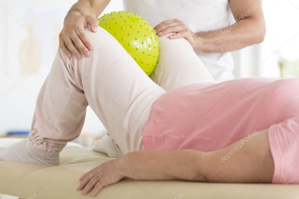 Patient during rehabilitation with physiotherapist