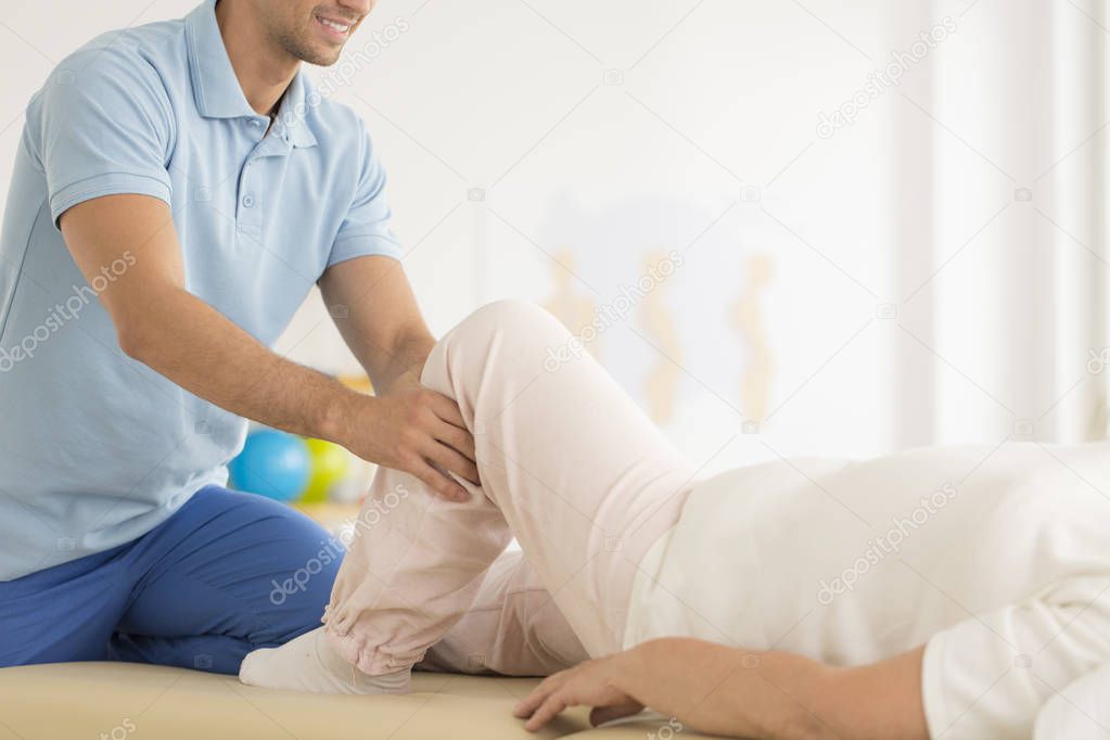 Physiotherapist helping in correct positioning