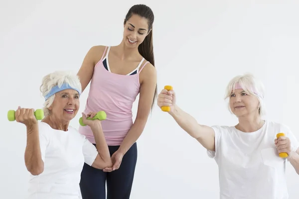 Elder ladies during arms training — Stock Photo, Image