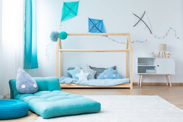 Blue child 's bedroom with mattress
