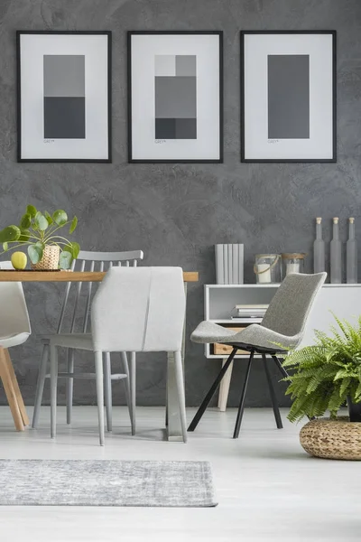 Grey chairs by the table — Stock Photo, Image