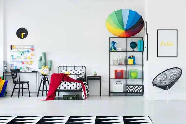 Rainbow umbrella on rack — Stock Photo, Image