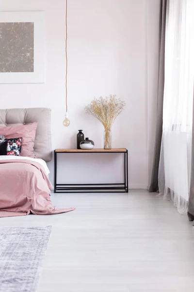 Nightstand, artwork and light bulb — Stock Photo, Image