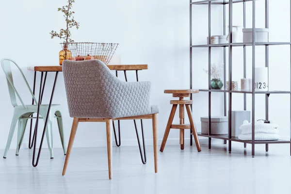 Armchair by table — Stock Photo, Image