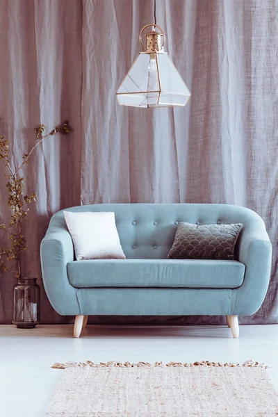 Grey apartment with blue settee — Stock Photo, Image