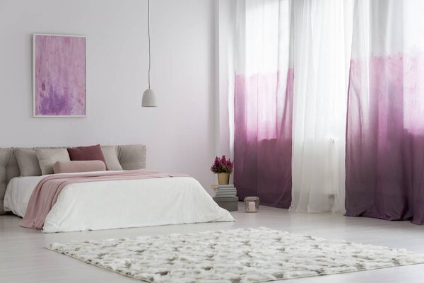 Gradient curtains in bright bedroom