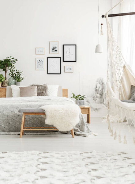 White bedroom with plants