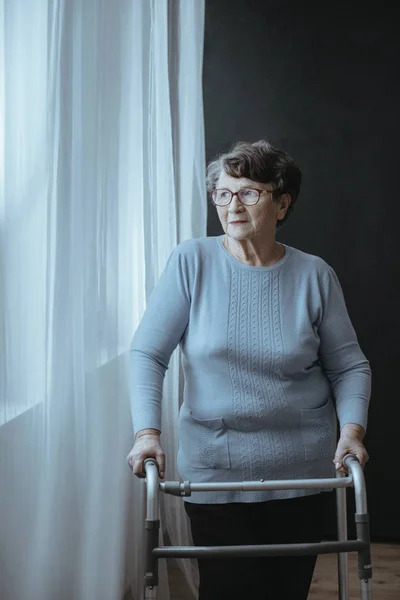 Senior woman with walker — Stock Photo, Image