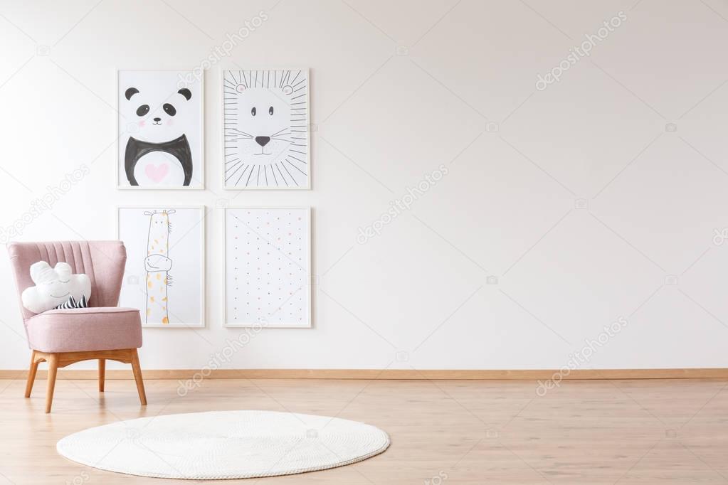 Pink armchair in baby's room