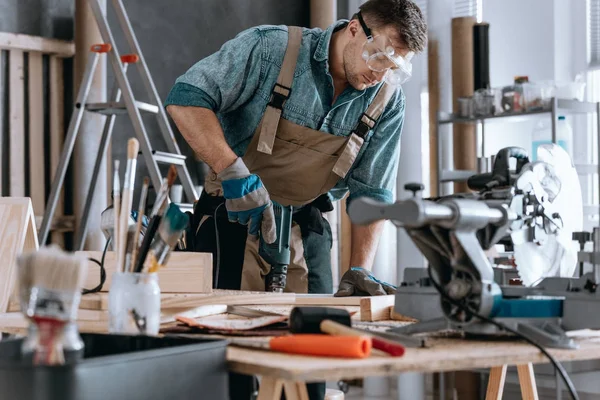 Young contractor drilling hole — Stock Photo, Image