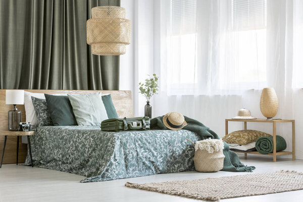 Rattan lamp in bedroom interior