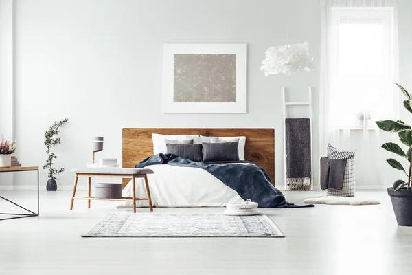 Spacious bedroom with silver painting — Stock Photo, Image