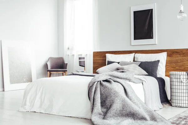 Simple bedroom with dark poster — Stock Photo, Image