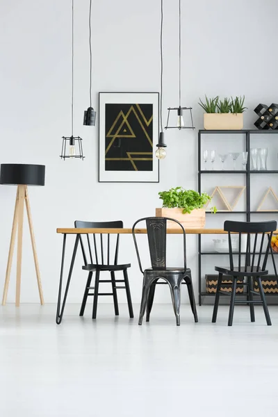 Black chairs in bright interior — Stock Photo, Image