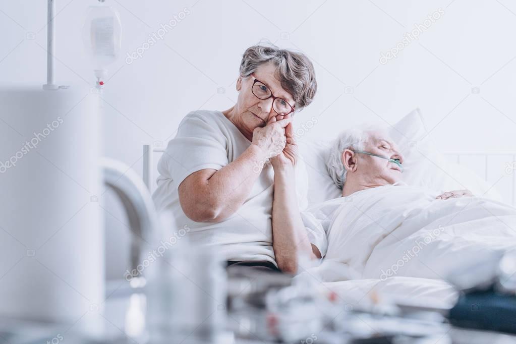 Loving wife at hospital bed