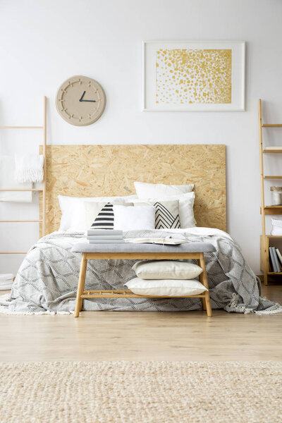 Gold painting in boho bedroom