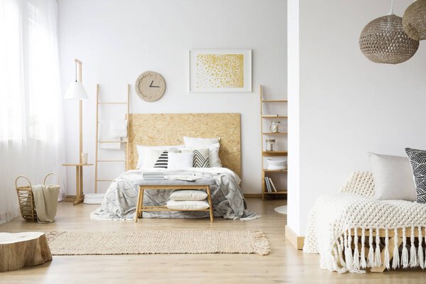 Spacious bohemian bedroom with wood