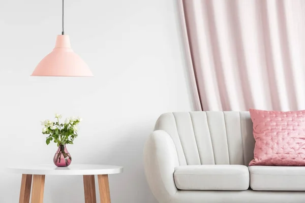 Peach lamp above wooden table — Stock Photo, Image