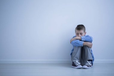 Sad alienated child with autism clipart