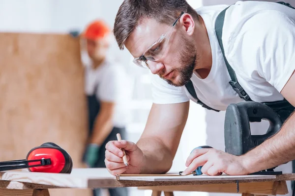 Close-up of carpenter with goggles — Stock Photo, Image