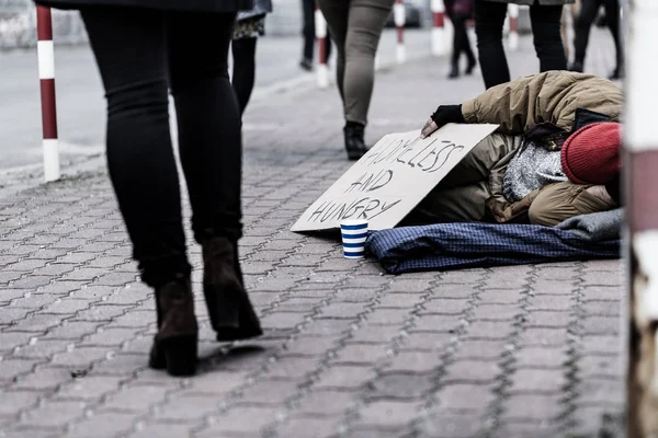 Dirty person on the sidewalk — Stock Photo, Image