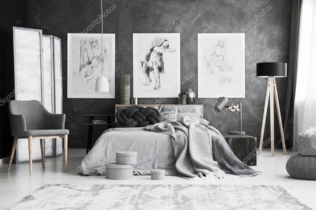 Grey chair in bedroom