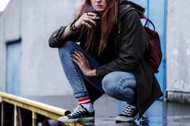 Teenage girl smoking cigarette clipart