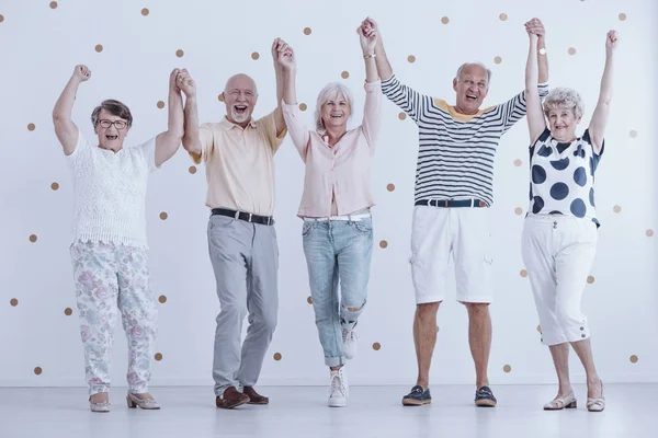 Elders holding hands — Stock Photo, Image