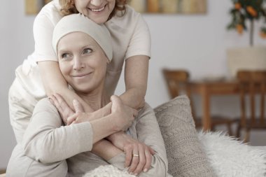Family member supporting sick woman clipart